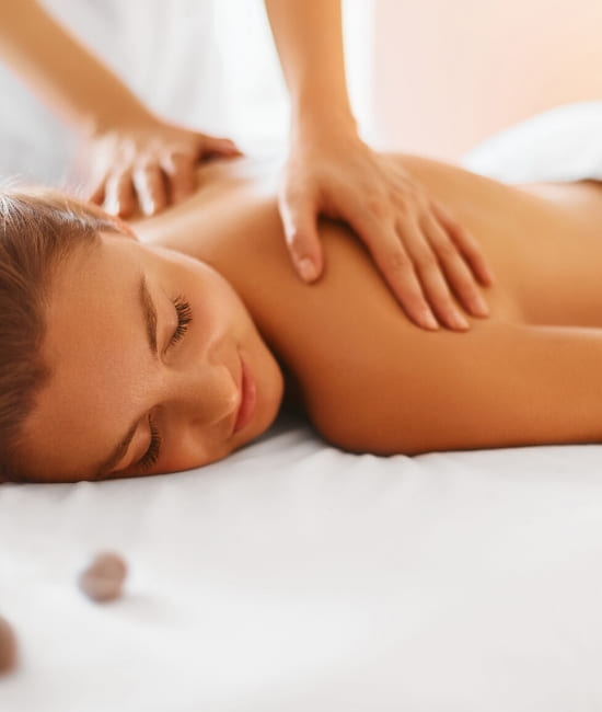 A young woman receiving a back massage